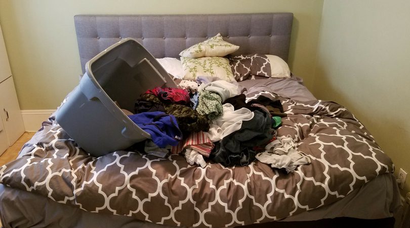 Laundry pile on bed